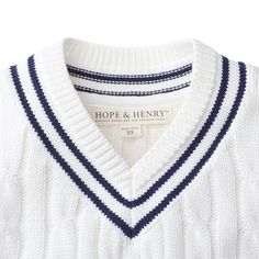 Stay sharp in our preppy cable knit cricket sweater in plush 100% organic cotton. Beautiful cable knit adorns the entire sweater and is trimmed in stripes at the neck, sleeves and hem. This is a sweater to treasure and pass down for years to come. 100% Organic Cotton, exclusive of trims. Garment made using conventional production methods. Learn more about certifications here. Cable knit throughout entire sweater. Contrasting navy stripes at neck, sleeve cuffs, and bottom hem. Machine washable. Luxury Button-up Polo Sweater With Buttons, Luxury Striped Polo Sweater With Ribbed Collar, Luxury Button-up Polo Sweater, Luxury Polo Sweater With Placket, Luxury Fitted Polo Sweater With Polo Collar, Luxury Winter Button-up Polo Sweater, Luxury Fitted Polo Sweater With Buttons, Luxury Classic Button-up Polo Sweater, Luxury Classic Polo Sweater With Buttons