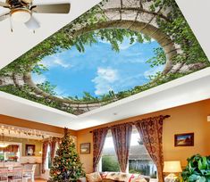 a living room filled with furniture and a christmas tree in the middle of the room