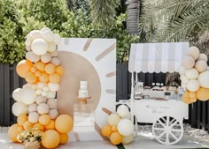 an ice cream cart decorated with balloons and decorations