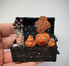 there is a miniature halloween decoration in the shape of a trunk