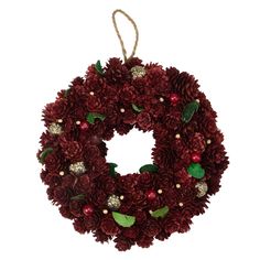 a christmas wreath with red flowers and green leaves