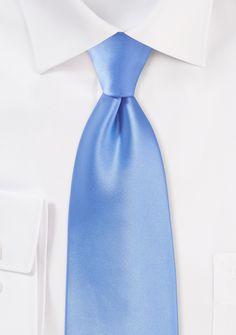 The bright brilliance of this light blue tie is the ideal compliment to the warm spring and summer days. This tie will look best with a light or medium grey suit and a white dress shirt. This tie is constructed of a material referred to as microfiber. A really distinctive fabric is microfiber. While nearly comparable to silk in appearance and texture, it has the advantage of being far more stain- and wrinkle-resistant. Any lighter, solid-colored neckties will look great with this material. Light Blue Tie Suit, Formal Ties For Spring, Spring Formal Tie, Light Blue Accessories For Black Tie Event, Solid Color Ties For Black Tie Events In Spring, Solid Color Spring Ties For Black Tie Events, Formal Suit And Tie Accessories For Spring, Classic Blue Ties For Formal Occasions, Blue Tie For Black Tie Occasions