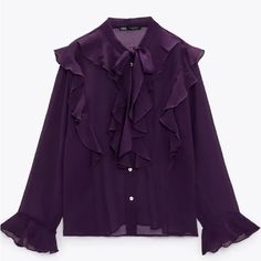 Semi-Sheer Blouse With High Tied Collar And Long Sleeves. Ruffled Trim. Front Button Closure. Purple 3666/195 #Fi Tie Neck Ruffled Blouse For Workwear, Ruffled Tie Neck Blouse For Work, Fall Blouse With Ruffles And Tie Neck, Fall Tie Neck Blouse With Ruffles, Office Blouse With Ruffles And Tie Neck, Purple Blouse With Ruffled Collar, Purple Ruffled Collar Blouse With Ruffles, Purple Tops With Ruffles And Ruffled Collar, Feminine Purple Blouse With Ruffles