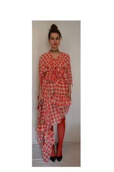 A one-off strawberry, pink and cream cotton gingham asymmetrical wraparound draped layered dress. A sleeveless dress that are part of a cape construction and can be worn over the shoulder or left dangling. This dress is completely constructed with pleated and ruffle sessions and is fastened with an array of raspberry strips and belts. Dress length is 78cm   Length to deepest pointed panel 150cm Wraparound waist tie fastening Fits up to size Large (UK12) Gingham Dress, Waist Tie, Dress Clothes For Women, Gingham, Dress Length, Sleeveless Dress, Dress Outfits, Bathing Beauties, Womens Dresses