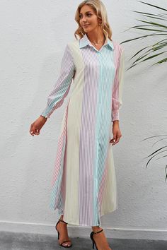 This maxi dress features a vibrant rainbow stripe pattern and a button-up front, perfect for casual yet stylish looks. With its flowing design, it is perfect for any occasion. Made for women who want to effortlessly make a statement with their fashion choices. Type: Shirt dress Sizing category: Regular Pattern type: Striped Style: Casual Features: Smocked, buttoned Neckline: Collared neck Length: Midi Sleeve length: Long sleeves Sleeve type: Lantern sleeves Material: 100% polyester Stretch: No s Button Shirt Dress, Maxi Shirts, Striped Shirt Dress, Maxi Shirt Dress, Striped Maxi, Necklines For Dresses, Crop Top Blouse, Shirt Skirt, Rainbow Stripes