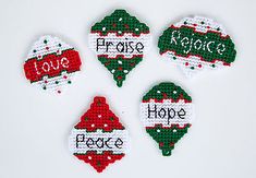 four christmas ornaments with the words peace, hope, and love