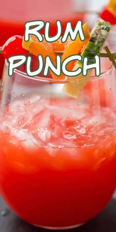 a close up of a drink in a glass with the words rum punch on it