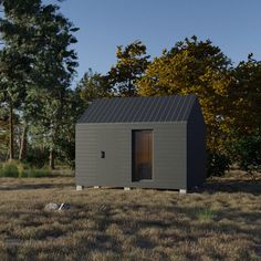 a small gray building sitting in the middle of a field