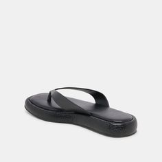 We love the simplicity of ADIN. This easy-to-wear sandal features a flip-flop strap and slightly platformed sole. Choose from classic colorways or make a statement in metallic. Leather Upper Rubber Outsole Synthetic Lining + Sock 0.2" Platform Height Imported Modern Black Platform Slippers With Textured Sole, Sleek Synthetic Toe Post Sandals, Modern Black Toe Loop Sandals, Modern Slip-on Flip Flops With Rubber Sole, Modern Flip Flops With Rubber Sole, Sleek Summer Flip Flops, Sleek Sandals With Cushioned Footbed For Beach, Sleek Black Flat Sandals, Sleek Synthetic Flip Flops For Summer