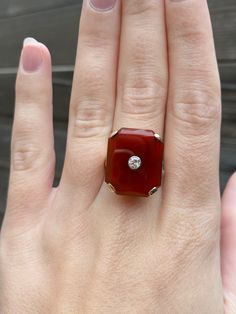 Total Weight: 8.7 grams Size: 7 Band Width: 2-6mm Carnelian: 20x17mm Diamond: approximately 3mm Condition: In great vintage condition. Lightly polished showing little wear. Carnelian and diamond both in great shape. Sizing insert isn't making it much smaller and can be remove upon request.  All gold has been thoroughly checked with an Olympus XRF spectrometer. It is guaranteed 14k gold.  All our jewelry is properly washed and disinfected to ensure customers get clean items with every order.  Ret Classic Yellow Gold Carnelian Jewelry, Classic Carnelian Rings With Polished Finish, Classic Carnelian Yellow Gold Jewelry, Luxury Carnelian Ring For Formal Occasions, Formal Red Carnelian Ring, Elegant Carnelian Ring In Yellow Gold, Elegant Carnelian Yellow Gold Rings, Elegant Yellow Gold Carnelian Ring, Classic Carnelian Ring Jewelry