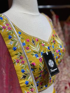 Saffron yellow lehenga elaborate work done all over the lehenga with multicolor resham detailing in floral design and highlighted with flux mirror and zari embroidery. Accomplished with similarly embroidered blouse and Look outstanding by styling a contrasting pink cut net dupatta. A saffron yellow that is not only dreamy but whimsical as well. Fabric : Silk Size: 38/M Ready to Ship! Semi-stitched Lehenga With Resham Embroidery For Festival, Anarkali Semi-stitched Choli With Zari Work, Floor-length Lehenga With Multicolor Embroidery For Diwali, Designer Kundan Lehenga With Intricate Embroidery, Party Lehenga With Intricate Embroidery In Raw Silk, Designer Resham Embroidery Raw Silk Lehenga, Designer Resham Embroidered Raw Silk Lehenga, Designer Raw Silk Lehenga With Resham Embroidery, Bollywood Zari Work Designer Sets