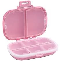 a pink plastic case with compartments for small items