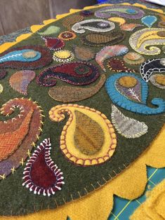 a close up of a colorful rug on the floor