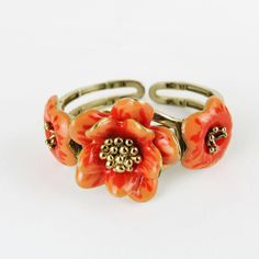 Gorgeous vintage articulated bracelet with enameled flower.       Condition:  Very good preowned condition.  Creator: -  Materials and Techniques:  metal, enamel  Marks:    Date (~):  1960s  Place of Origin:  France  Measurements: Diameter interior 5,5 cm, middle flower 3,5 cm  Weight: circa 70 gr Retro Enamel Bracelet For Gift, Retro Enamel Bracelets For Gifts, Retro Enamel Bracelets For Gift, Adjustable Flower Shaped Metal Ring, Adjustable Metal Flower Ring, Vintage Enamel Bangle Jewelry, Unique Enamel Flower Shaped Jewelry, Unique Enamel Flower Jewelry, Vintage Orange Flower Jewelry