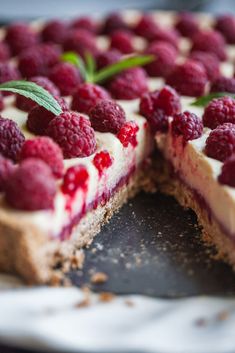 a dessert with raspberries and cream on top