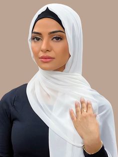 Our Luxury Chiffon hijab-Pearl White is perfect for every occasion. With the softest chiffon fabric we could find, our Luxury Chiffon will become your go to hijab whether you're going out to a fancy party or keeping it casual, looking beautiful is effortless! Fabric: Polyester Chiffon Dimension: 70" x 27" Contour: Long Rectangle Thickness: Light Texture: Smooth Care: Machine or hand wash in warm water, tumble dry or air dry, iron if needed. Elegant Niqab For Eid, Elegant Solid Niqab For Eid, Elegant Solid Chiffon Hijab, Elegant Solid Color Chiffon Hijab, Elegant Wedding Hijab, Elegant White Hijab For Eid, Elegant Chiffon Headscarf For Eid, Elegant Chiffon Headscarf, Elegant Chiffon Khimar For Eid