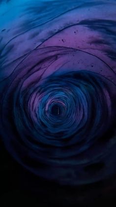 the inside of a blue and purple swirl