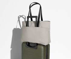 Shop The Everywhere Tote | Away: Built for modern travel Modern On-the-go Tote Luggage, Versatile Waterproof Bag For Commuting, Functional Travel Tote Laptop Bag, Modern Waterproof Bags For Commuting, Modern Waterproof Tote Bags, Versatile Waterproof Shoulder Bag For Travel, Modern Commuting Laptop Tote Bag, Modern Travel Laptop Bag With Double Handle, Modern Double Handle Luggage For Travel