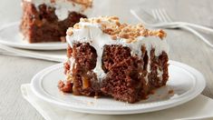 two pieces of cake sitting on top of white plates