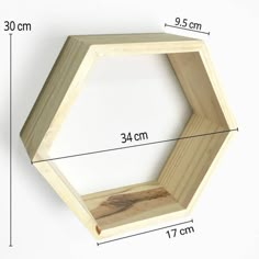 a wooden hexagonal shelf is shown with measurements