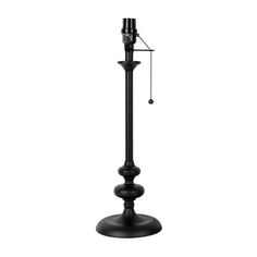 a black lamp with a chain hanging from it's side