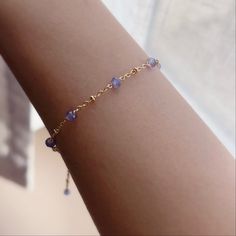 "* DETAILS* This dainty bracelet is a perfect gift to the one you love or to yourself. A nice every day bracelet. - Natural AAA+ Tanzanite Faceted Rondelle Beads 3-4 mm - 14k Gold Filled Chain - 14K GOLD FILLED Wire - 14k Gold Filled Spring Ring Clasp - 14k Gold Filled Link Rings Bracelet has a 1\" extension with tanzanite bead charm. ✨All components are gold filled. 👉🏻For more birthstone bracelets, see https://www.etsy.com/shop/JinnysJewelryBySeJin You may also like 🌟Twisted link chain brace Delicate Blue Bracelets For Everyday, Handmade Elegant Beaded Bracelets For Birthday Gift, Elegant Handmade Beaded Bracelets For Birthday Gift, Dainty Jubilee Beaded Bracelets As A Gift, Elegant Handmade Beaded Bracelet For Birthday Gift, Dainty Chain Bracelet With Round Beads For Gift, Delicate Beaded Bracelet With Adjustable Chain For Gift, Dainty Chain Bracelet With Round Beads, Dainty Crystal Bracelet With Adjustable Chain