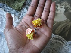 A lovely pair of vintage 1950's realistic celluloid floral screw back earrings. Each earring measures 1 1/8'' x 1 1/8''. In good vintage condition. Vintage Flower Clip-on Earrings For Wedding, Vintage Flower Earrings For Anniversary, Vintage Yellow Flower Earrings, Vintage Celluloid, Earrings Wedding, Screw Back Earrings, Wedding Earrings, Flower Earrings, Vintage 1950s