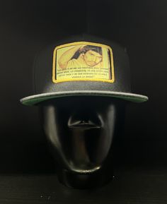 This caro Quintero flat bill SnapBack makes as a great gift to you or someone else. Every hat comes with a complementary decal and first class shipping. Embroidery on the front and back. If you have any questions feel free to let me know! Follow us on Instagram! @Buenamadera1978 ------------------------ Esta gorra de Caro Quintero es un gran regalo para ti o para otra persona. Cada cachucha viene con una calcomanía complementaria y envío de primera clase. Bordado en la parte delantera y trasera. Adjustable Black Trucker Flat Cap, Black Retro Snapback Trucker Hat, Retro Black Baseball Cap With Flat Bill, Casual Snapback Hat With Flat Bill As Gift, Casual Snapback Hat With Flat Bill, Retro Black Flat Bill Baseball Cap, Black Retro Fitted Hat With Flat Brim, Casual Flat Bill Snapback Hat, Black Casual Trucker Hat As Gift