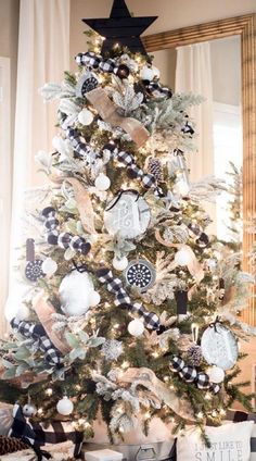 a christmas tree decorated with black and white ornaments