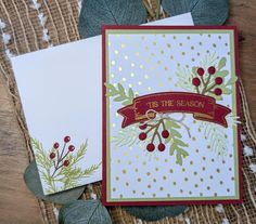 two christmas cards on top of each other with leaves and berries around the edges that says tis the season