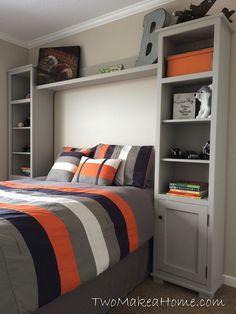 a bed room with a neatly made bed and shelves