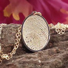 "Free first class shipping on all items with standard gift box! Free priority shipping on orders over $140 with upgraded gift box! U.S. shipments only These are very high detailed copied fingerprint pendants deeply cut into SOLID 14k yellow gold. These come standard mounted on a free 18 inch sterling silver chain. You will not find a higher quality memorial item than my items, plus these ship much faster and at a fraction of the price you will find offered from funeral homes. Optional is a 18 in Gold Oval Pendant Necklace For Memorial, Yellow Gold Oval Pendant Jewelry For Memorial, Yellow Gold Brass Necklace For Memorial, Fingerprint Necklace Memorial, Memorial Pendant Necklace In Brass, Fingerprint Necklace, Memorial Necklace, Oval Pendant, Memorial Jewelry