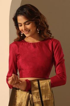 Viva magenta blouse with crafted in pure silk base.
Components: 1
Pattern: Plain
Neckline: Round Neck
Sleeve Type: Full Sleeves
Fabric: Pure Silk
Color: Red
Other Details: 
Model height: 5ft 6inches, wearing size S
Note: The saree worn by the model is not for sale
Occasion: Sangeet - Aza Fashions Full Neck Blouse Design, Full Sleeve Blouse Designs, Full Sleeves Blouse Designs, Magenta Blouse, Red Silk Blouse, Saree Wearing Styles, Round Neck Blouse, Saree Wearing, Indian Sari Dress