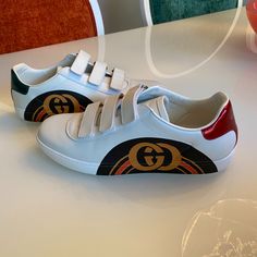 Worn Once But They Look Brand New Authentic Size 9 Gucci Sneakers With Logo And Round Toe, Gucci Sneakers With Logo, Gucci Leather Sneakers With Logo, Designer Sneakers With Logo Detail And Round Toe, Gucci Leather Sneakers With Logo Detail, Gucci Sporty Custom Sneakers With Logo, Gucci Custom Logo Sporty Sneakers, Sporty Gucci Custom Sneakers With Logo, Gucci Low-top Sneakers With Logo Detail