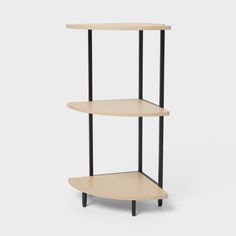 the three tiered shelf is made from wood and black metal, with two shelves on each