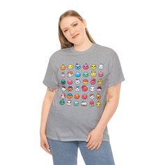 Introducing our Funny Emojis T-Shirt - a playful and expressive addition to your wardrobe that brings a touch of humor to your everyday style. This tee is a canvas of emotions, letting you wear your feelings and share a laugh wherever you go. 😄 Emoji Extravaganza: Our Funny Emojis T-Shirt showcases an array of quirky emojis that reflect a range of emotions. It's like having your very own emoji conversation right on your shirt! 🤣 Wearable Laughter: Designed to spread smiles, this tee is the per Multicolor Pop Culture Tops With Funny Print, Fun Gray Short Sleeve T-shirt, Funny Smiley Face Short Sleeve Top, Gray Graphic Tee With Character Print, Playful Gray Cotton T-shirt, Funny Short Sleeve Gray Tops, Playful Gray Graphic Print Top, Playful Gray Top With Graphic Print, Funny Cotton Tops With Smiley Face