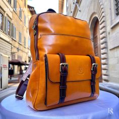 "This Italian leather Backpack is a true masterpiece of craftsmanship. Handmade in Florence, Italy, it combines luxurious materials and exquisite attention to detail. Elevate your style and travel in sophistication with this elegant backpack. . Size: Height: 39 cm (15.35 inches) Depth: 31 cm (12.20 inches) Width: 13 cm (5.12 inches) Color: Yellow . The story of this backpack: In the heart of Florence, where the legacy of artisanal craftsmanship dances through the air like a melody, a workshop hums with the creation of a masterpiece--an Italian handmade leather backpack. This story unfolds within the walls where skilled hands weave dreams into reality, bringing forth a men's backpack that embodies the essence of tradition, quality, and timeless elegance. Selected with meticulous care, the l High-end Rectangular Travel Backpack, Luxury Formal Backpack With Leather Lining, Luxury Leather Business Backpack, Designer Rectangular Leather Backpack For Business, Designer Brown Leather Rectangular Backpack, High-end Leather Backpack, Luxury Leather-backed Backpack For Daily Use, Luxury Backpack With Leather Lining, Luxury Smooth Grain Leather Backpack For Business