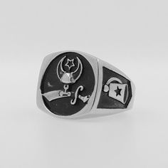 Show your pride and support for a great cause with our Shriners Ring in sleek black and silver titanium steel. This durable and stylish ring features the iconic Shriners emblem, making it the perfect way to honor this noble organization. Every purchase helps make a difference.We ship worldwide to 185 countries! Please allow 1-2 business weeks for your order to arrive. Adjustable Stainless Steel Engraved Ring, Adjustable Silver Titanium Rings, Black Stainless Steel Promise Ring, Silver Stainless Steel Ring With Brushed Finish, Black Stainless Steel Signet Promise Ring, Symbolic Black Stainless Steel Rings, Silver Stainless Steel Signet Promise Ring, Silver Stainless Steel Signet Ring For Promise, Black Stainless Steel Engraved Ring As Gift