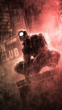 a man kneeling down in the rain next to a fire hydrant with a light on his head