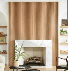 a living room filled with furniture and a fire place in front of a wooden wall