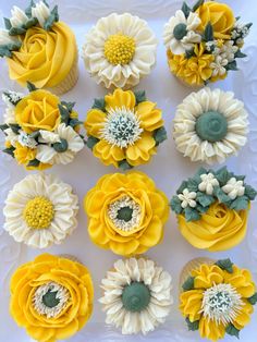 cupcakes decorated with yellow and white flowers