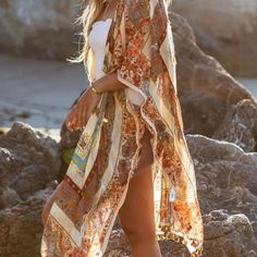 Go From The Beach To Dinner Looking Boho Chic Wearing This Gorgeous Kimono! Cream With Sky Blue, Sunset Corals, And Muted Rust Colors. Split Sides, Belt For A Different Look. Wear With Flip-Flops Or Cowboy Boots. One Size Fits Most 40" Long 100% Polyester Airy, Anthro, Anthropologie, Asian, Bali, Beach, Boho, Boho Chic, Bohemian, California, Casual, Celeb Style, Coachella, Cowboy, Cowgirl, Crystals, Delicate, Dream, Earthy, Eclectic, Ethereal, Floral, Free People, Friends, Festival, Free Spirit, Bohemian Multicolor Tassel Cover-up, Summer Kimono With Tassels, Yellow Bohemian Festival Cover-up, Summer Long Kimono With Tassels, Spring Beach Kimono With Tassels, Summer Festival Kimono With Tassels, Bohemian Orange Printed Kimono, Beige Floral Print Beach Kimono, Bohemian Brown Cover-up For Summer