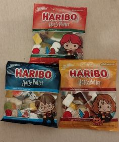 three bags of harry potter candy on a table