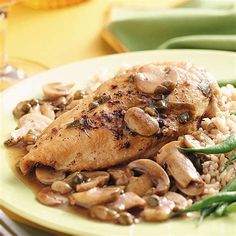 chicken with mushrooms and green beans on a plate