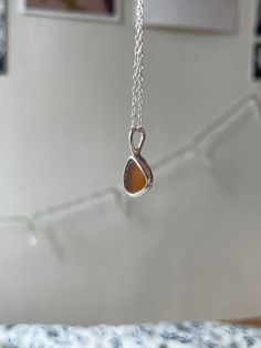 Handmade sterling silver Sea Glass necklace, made with recycled silver, and genuine Sea Glass from the Jurassic Coast. This necklace has one Small piece of Light Brown Sea Glass, and is very dainty and elegant.  This necklace is a perfect gift for a special occasion, and is perfect for Sea Glass lovers! The chain is 18" (45cm), and has an easy closure. All of the silver on the necklace is 925 Sterling Silver, including the chain and small jump rings! Feel free to message me for any additional information, or for commissions/custom requests! Brown Sea, Chain Jewellery, Jurassic Coast, Silver Sea, Jewellery Gifts, For Her Gifts, Sea Glass Necklace, Recycled Silver, Sea Glass Jewelry