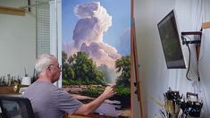 an older man is painting in his art studio while looking at the sky and clouds