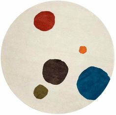 a white rug with multi colored circles on it