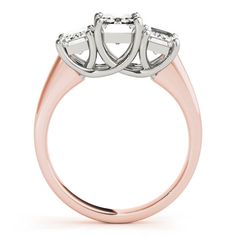 three stone engagement ring in rose gold and white gold with two diamonds on the side