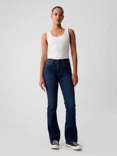 Fit: A full-length slim fit with a mini bootcut leg. ​ Fabric: 81% Cotton, 4% Recycled Materials, 6% Stretch.  Stretch: High Stretch Jeans.  Innovative stretch with high recovery.  Made to move & always bounces back. ​ Rise: Mid Rise Jeans.  Look: A classic five-pocket jean in a dark wash.  Details: Zip fly & five-pocket styling.  Responsibly Made: This pair of jeans is part of our water-saving Washwell program.  Compared to conventional wash methods, Washwell has saved millions of liters of wat Jeans Look, Boot Jeans, Baby Boots, Mid Rise Jeans, Pocket Jeans, Stretch Jeans, Bootcut Jeans, Jeans And Boots, Mid Rise