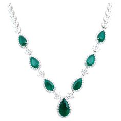 Check out this one-of-a-kind emerald necklace! The necklace features 7 natural Colombian emeralds weighing 10.25 ct and round brilliant cut diamonds weighing 17.3 ct set in 18k white gold. A gorgeous showstopper!! Formal Emerald Diamond Necklace In White Gold, Formal White Gold Emerald Diamond Necklace, Exquisite Pear-shaped Emerald Necklace For Formal Occasions, Dazzling Formal Emerald Gemstone Necklace, Hand Set Emerald Pendant Necklace For Formal Occasions, Hand-set Emerald Pendant Necklace For Formal Occasions, Emerald Diamond Necklace For Formal Occasions, Luxury Hand Set Emerald Diamond Necklace, Luxury Pear-shaped Emerald Gemstone Necklace